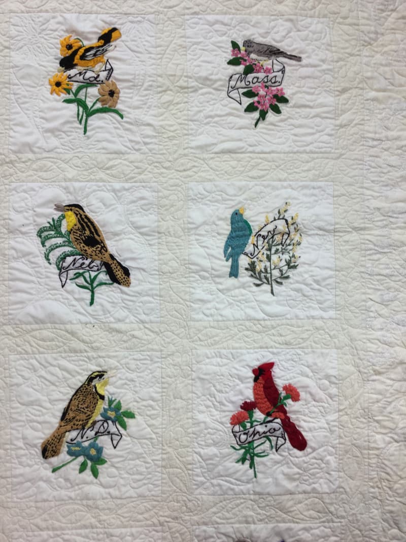 Stitch work of State Birds and Flowers on Quilt