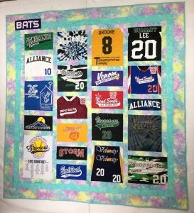 Image of a softball themed custom t-shirt quilt that I made for a customer
